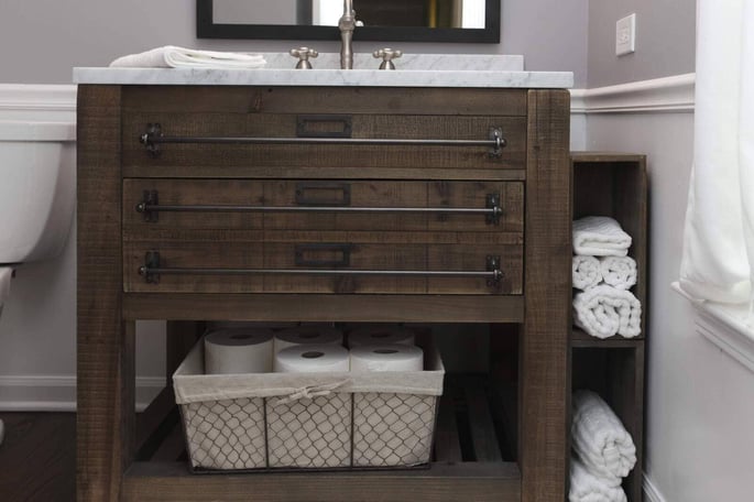 Details of bathroom vanity with built-in towel bar and storage