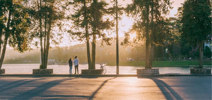 Lincolnshire Remodeling two people standing in front of water sunset