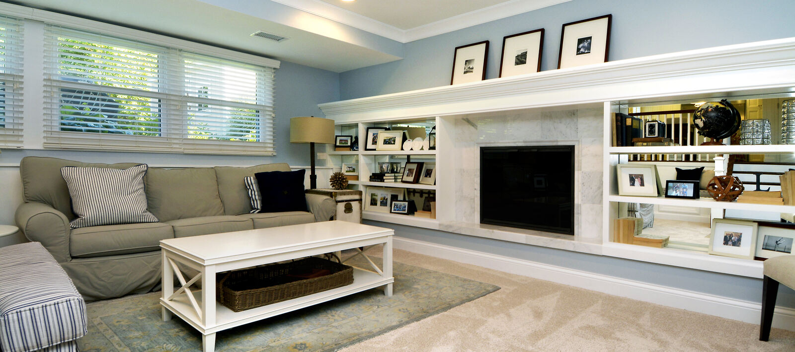 custom built in shelves with fireplace in middle in living room remodel in chicago.JPG