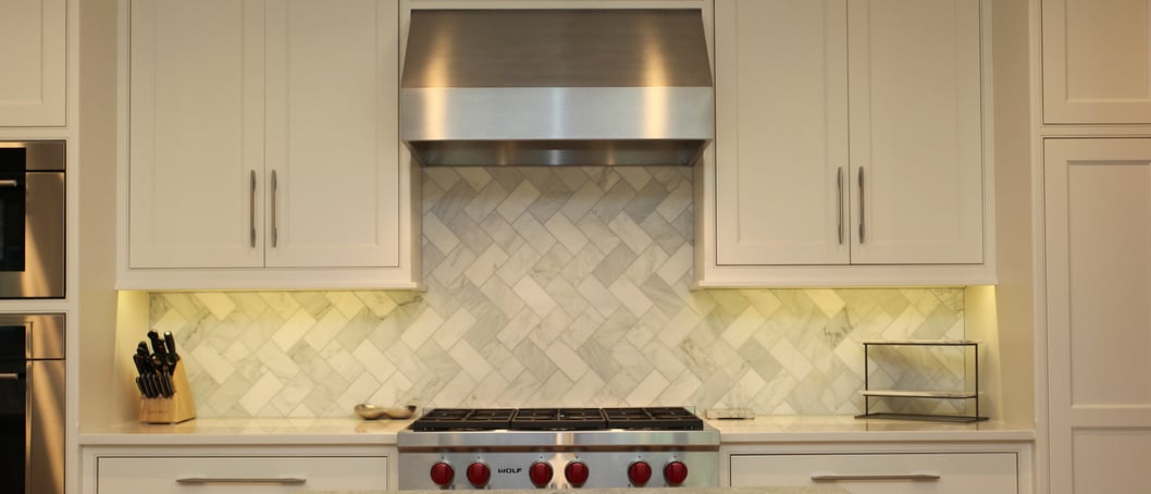 range hood in kitchen remodel with herringbone tile backsplash (1)
