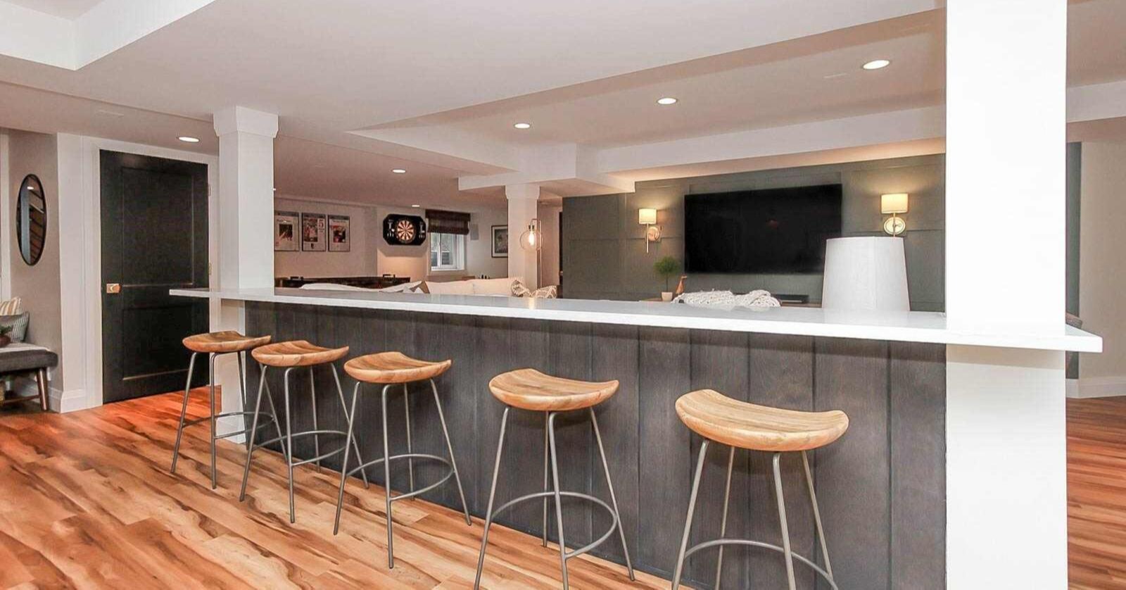 basement bar area with bar stools