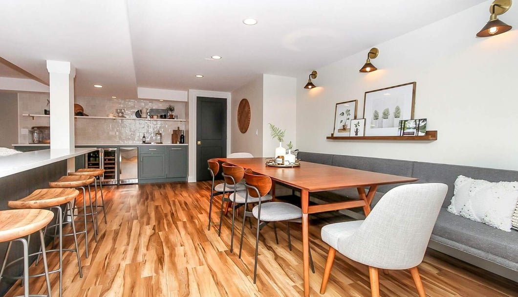 wooden basement flooring with booth seating and table-1