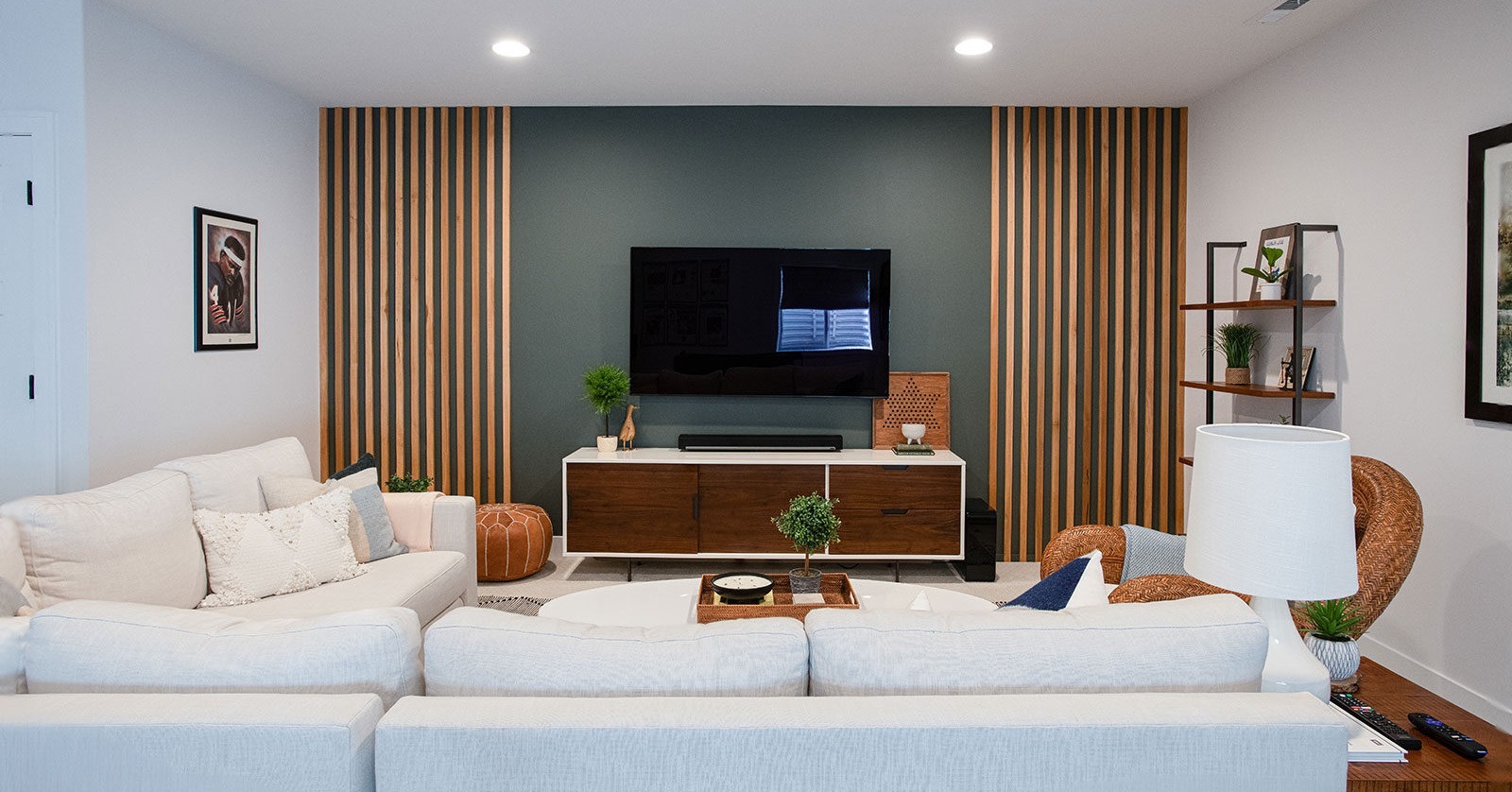 A modern, cozy TV entertainment area within a full basement renovation in Kildeer, IL completed by Patrick A. Finn.