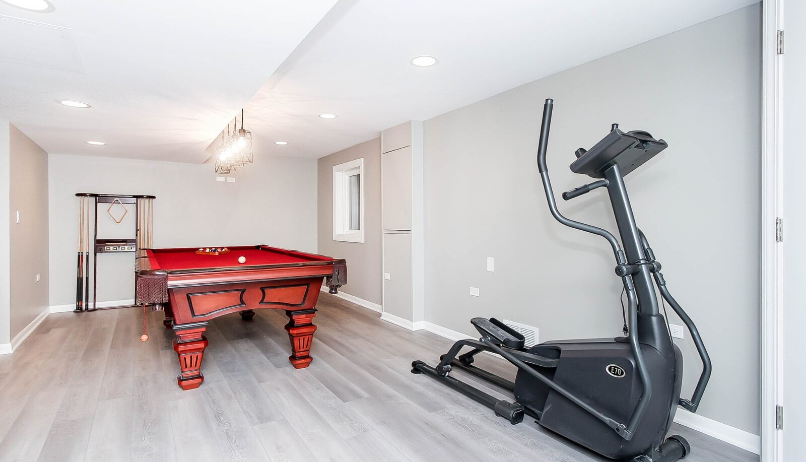 basement with exercise machine and pool table-1