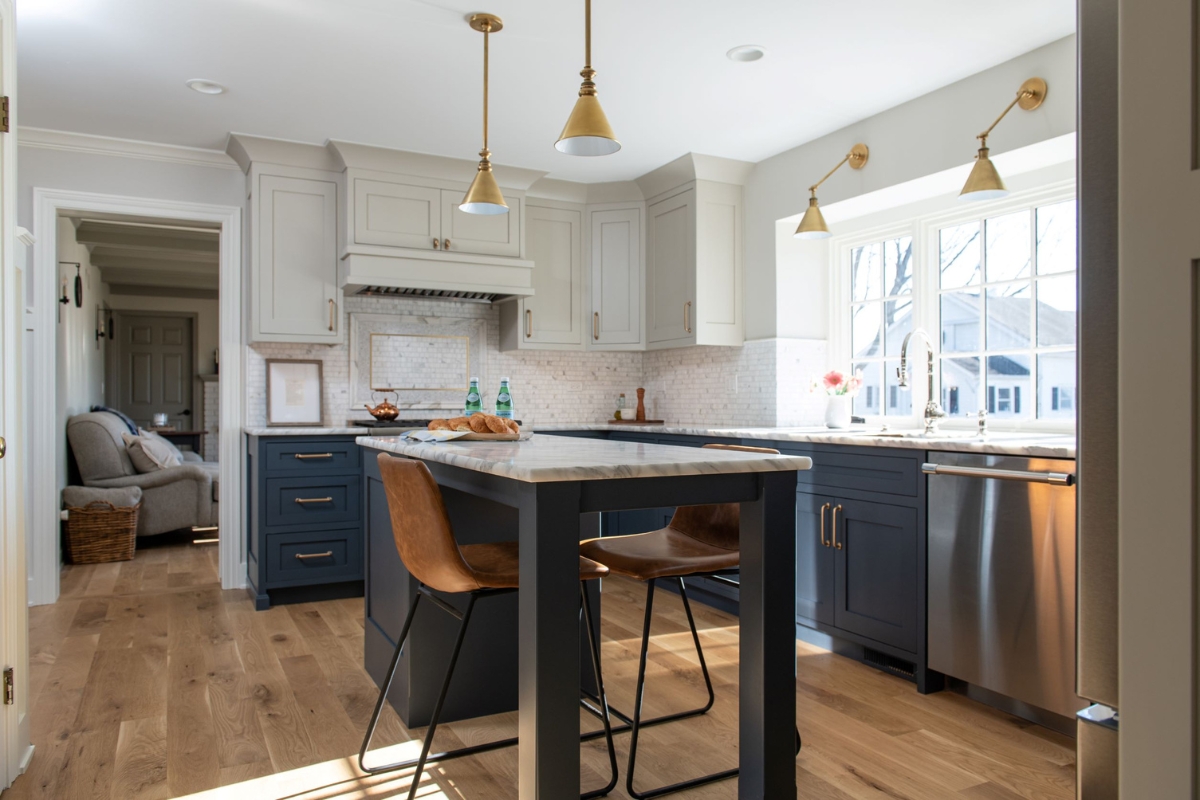 Two-tone kitchen with cabinets in the colors of Revere Pewter and Hale Navy