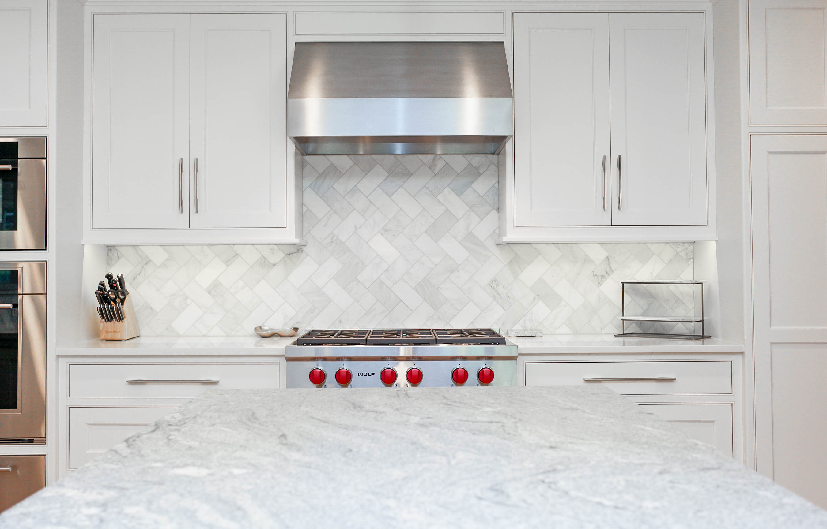 herringbone flooring and backsplash