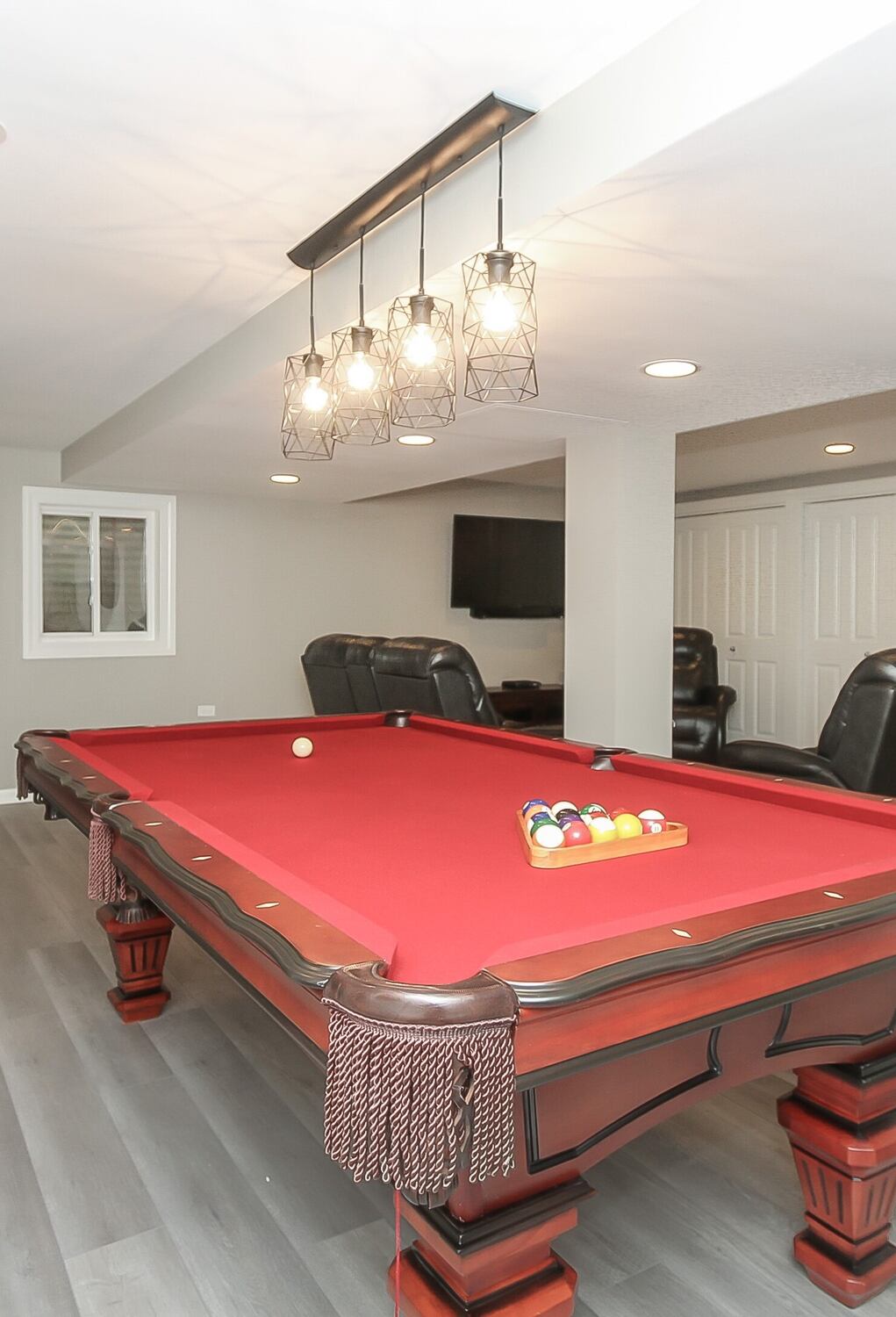 basement with pool table and exercise machine