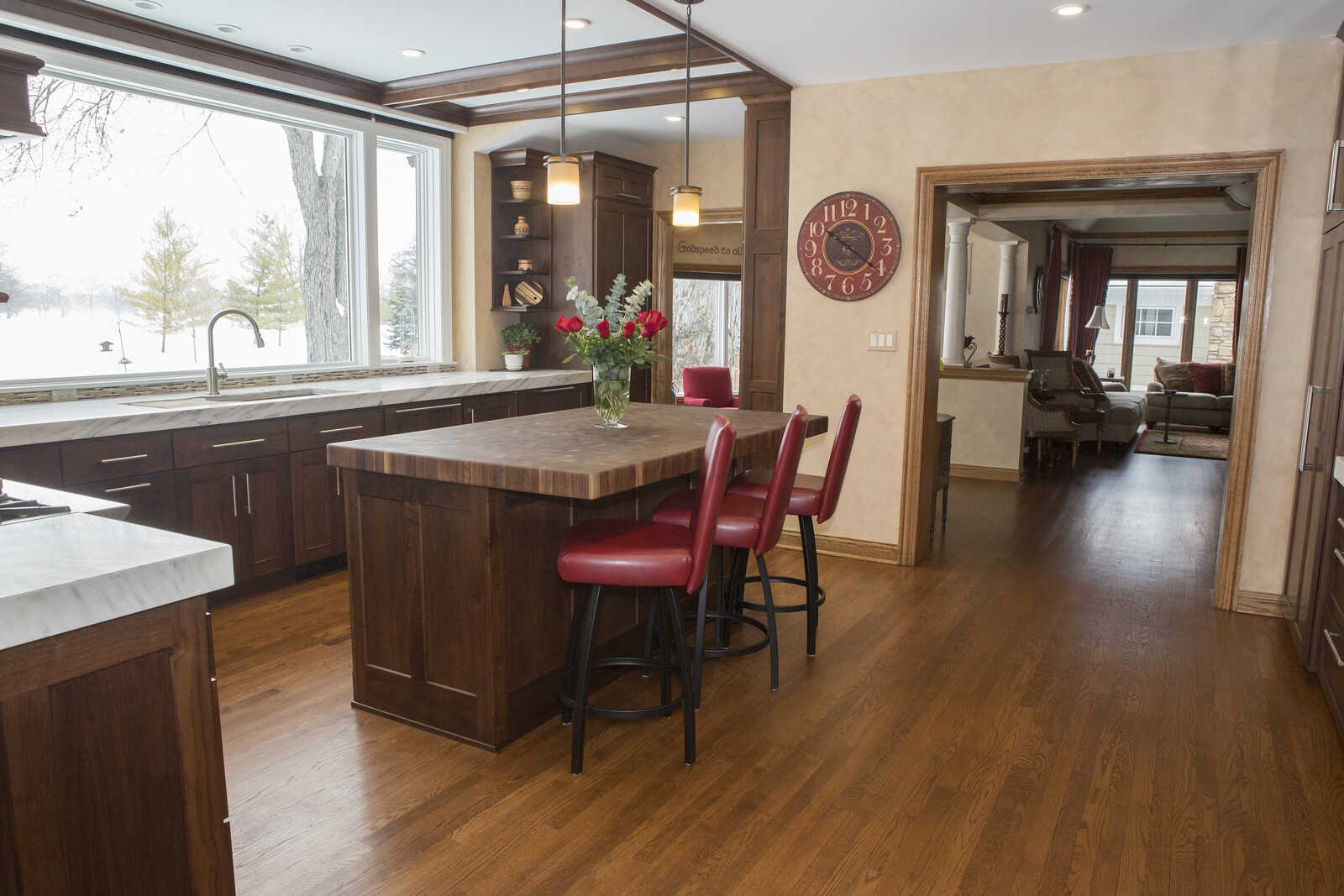 kitchen addition with island looking out window
